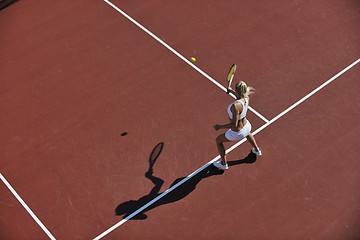 Image showing young woman play tennis outdoor