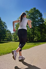 Image showing Young beautiful  woman jogging at morning in park