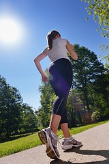 Image showing Young beautiful  woman jogging at morning in park