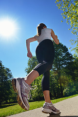 Image showing Young beautiful  woman jogging at morning in park