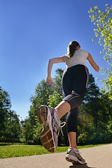 Image showing Young beautiful  woman jogging at morning in park