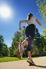 Image showing Young beautiful  woman jogging at morning in park