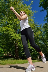 Image showing Young beautiful  woman jogging at morning in park