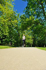 Image showing Young beautiful  woman jogging at morning in park