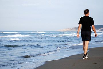 Image showing man running on beach