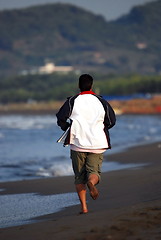 Image showing man jogging at beach 