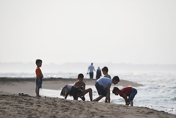 Image showing childs having fun on beach at early morning