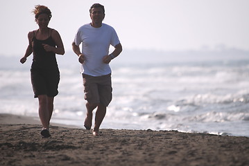 Image showing couple running on beach