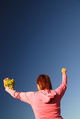 Image showing girl with grape outdoor