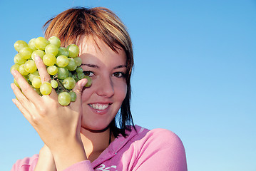 Image showing girl with grape outdoor