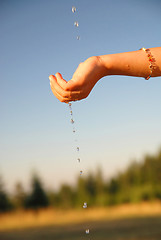 Image showing fresh water falling on children hands