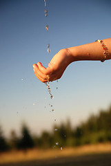 Image showing fresh water falling on children hands