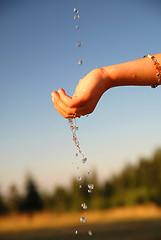 Image showing fresh water falling on children hands