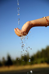 Image showing fresh water falling on children hands