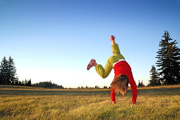 Image showing Girl doing exercise in nature