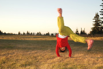 Image showing Girl doing exercise in nature