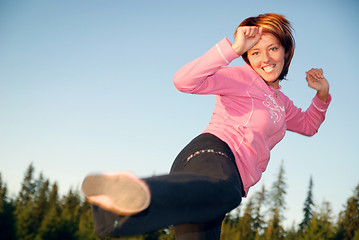 Image showing pretty girl doing exercise in nature