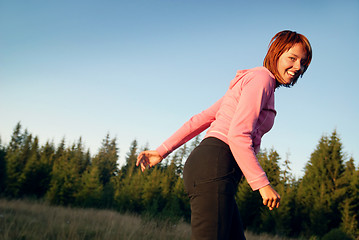 Image showing pretty girl doing exercise in nature