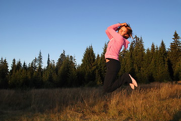 Image showing Jumping in to air