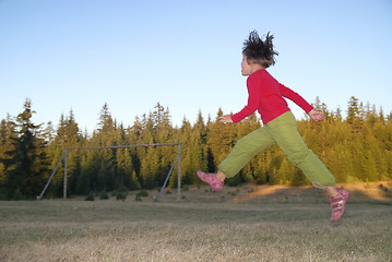 Image showing Jumping in to air