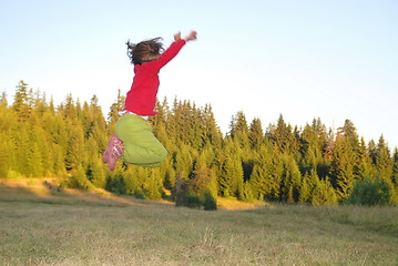 Image showing Jumping in to air