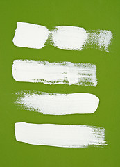 Image showing White brush strokes on green background