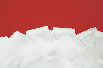 Image showing Red wall painted in white with paint roller