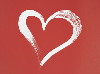 Image showing White heart painted on red background