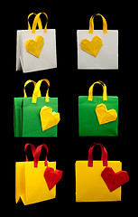 Image showing Shopping bags with heart. Isolated origami