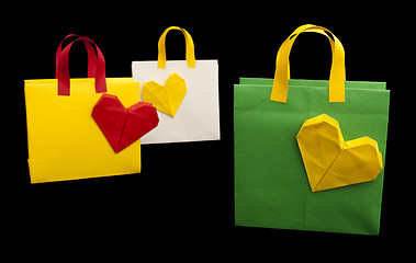 Image showing Shopping bags with heart. Isolated origami