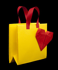 Image showing Yellow shopping bag with red heart