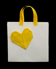 Image showing White shopping bag with yellow heart.