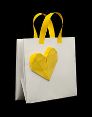 Image showing White shopping bag with yellow heart.