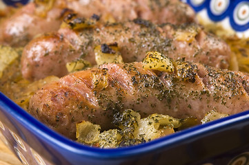 Image showing Roasted sausages with sauerkraut - polish dish