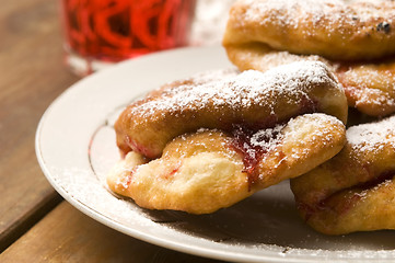 Image showing Sweet doughnuts with rose marmelade