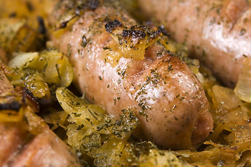 Image showing Roasted sausages with sauerkraut - polish dish