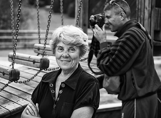 Image showing Senior Woman at the Park with photographer on background