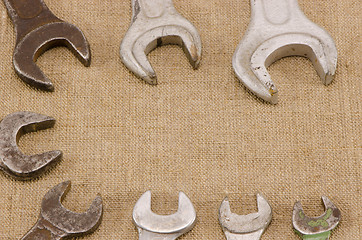 Image showing set size wrench screw tools on linen background 