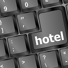 Image showing Hotel key in place of enter key - business concept