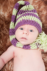 Image showing Newborn baby in striped cap
