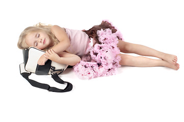 Image showing Little girl sleeping on the bag