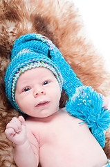 Image showing Newborn baby on blue knitted cap