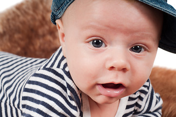Image showing Newborn baby in striped clothes