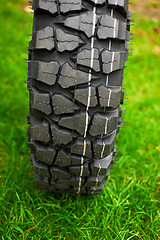 Image showing Tire at green grass