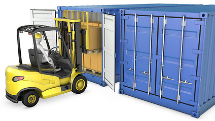 Image showing Yellow fork lift truck unloads cargo container