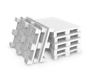 Image showing Stack of white plastic pallets