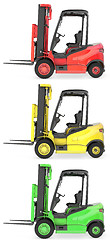 Image showing Three fork lift trucks colored as traffic lights