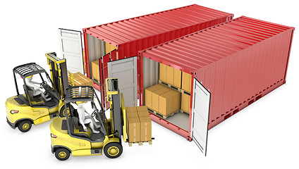 Image showing Two yellow lift truck unloading containers