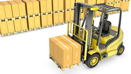 Image showing Yellow fork lift truck with stack of carton boxes