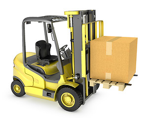 Image showing Yellow fork lift truck with large carton box